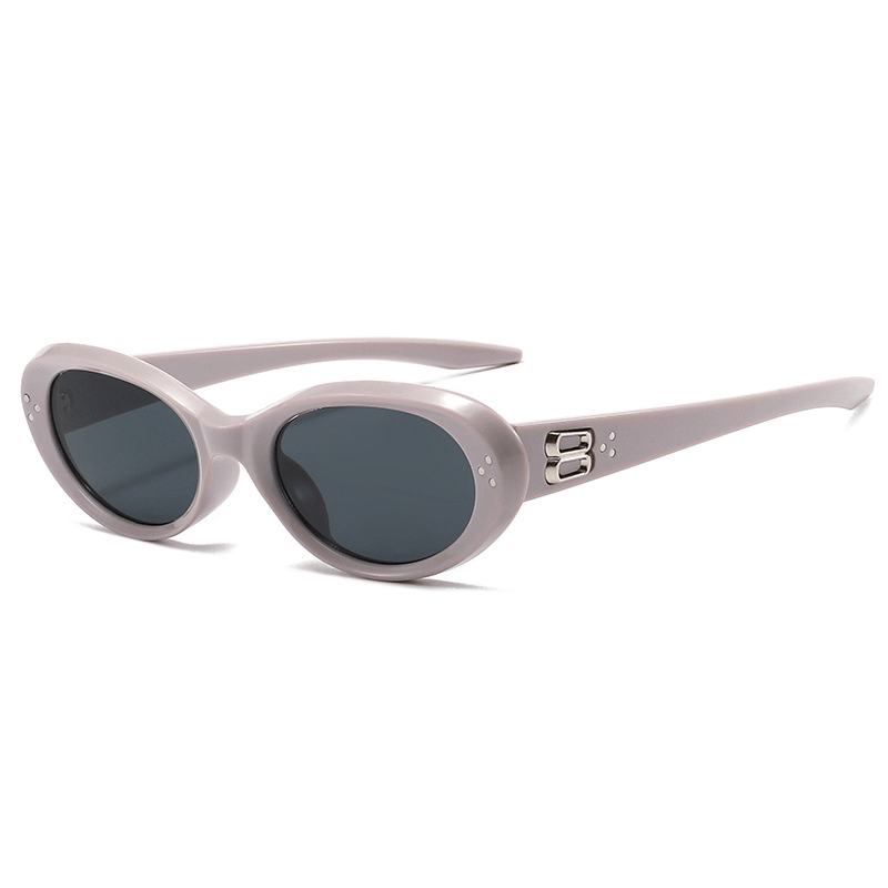 VELSUN-108 retro 90s oval sunglasses featuring a crystal clear translucent grey frame and dark smoke lenses
