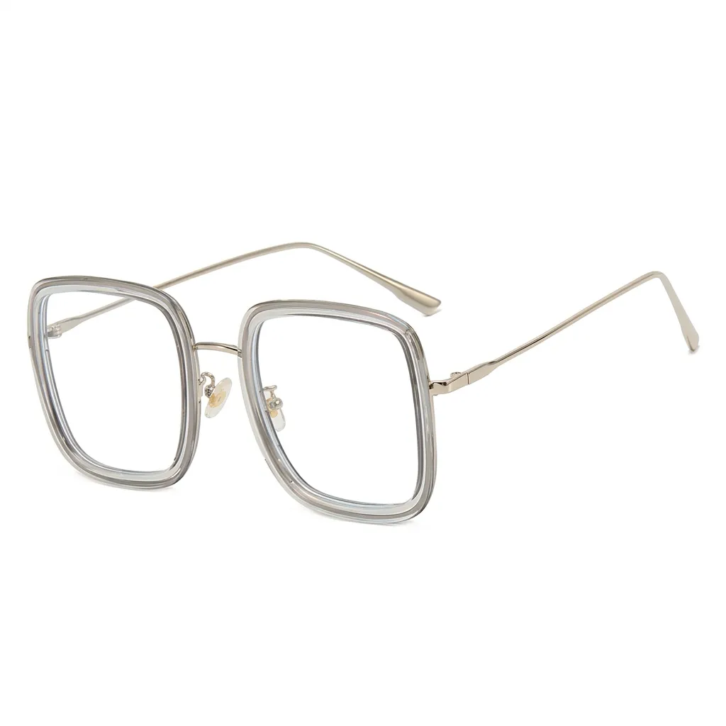 Modern Transparent Grey square eyeglasses with gold metal temples, trendy minimalist eyewear.